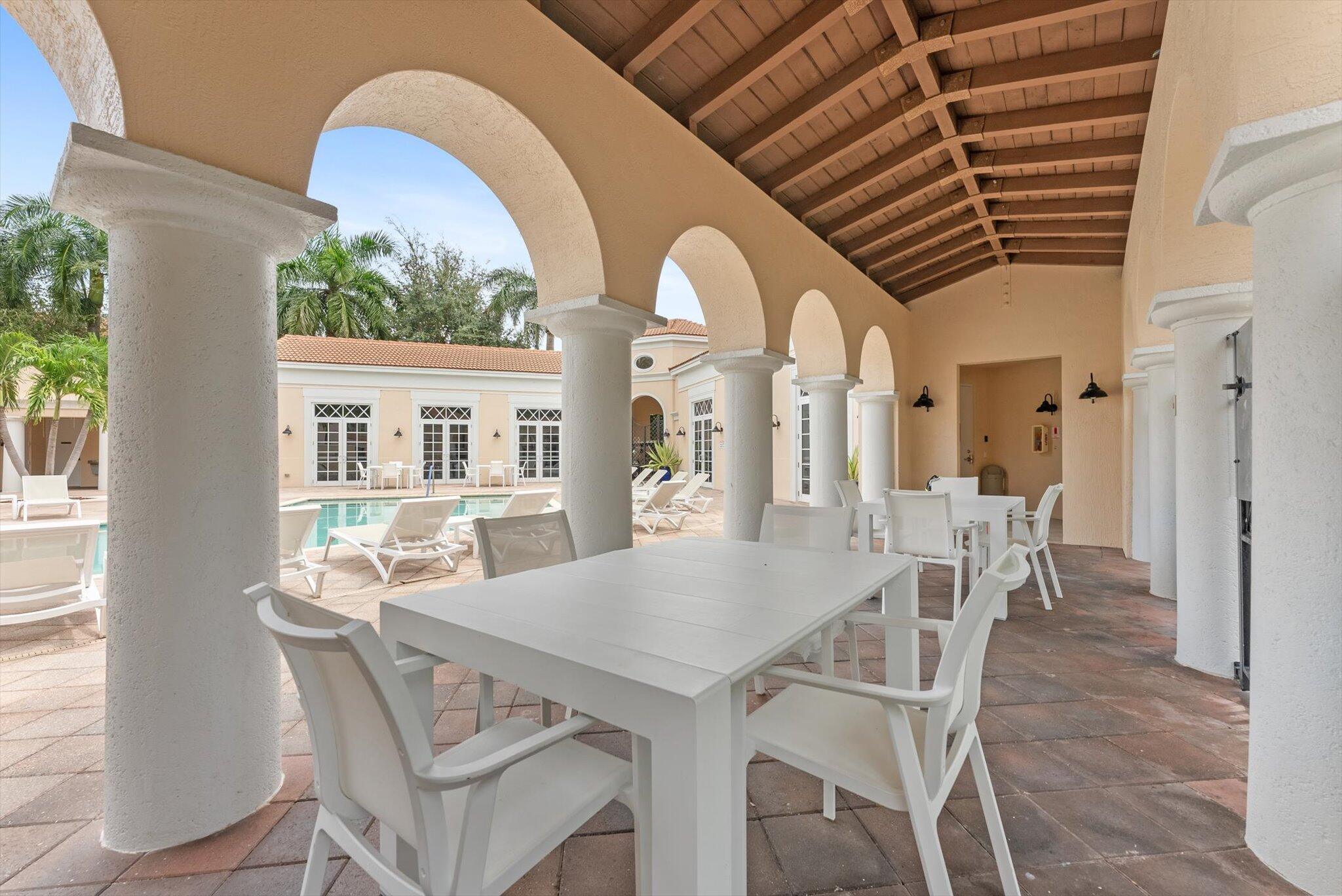 806 Northwest 83rd Lane Boca Raton, FL 33487 - Photo 29 of 37 a view of a dining room with furniture window and wooden floor