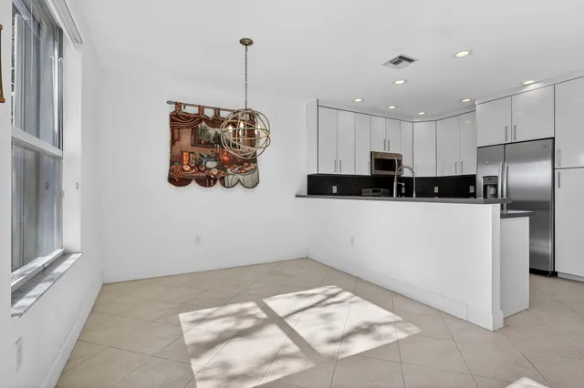 a living room with furniture and a ceiling fan