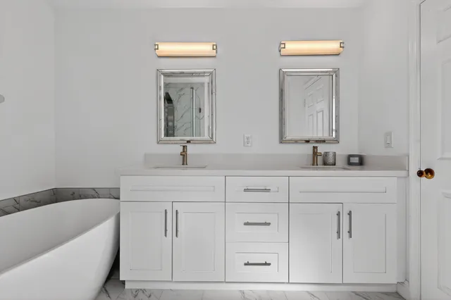 an empty room with wooden floor a ceiling fan and closet