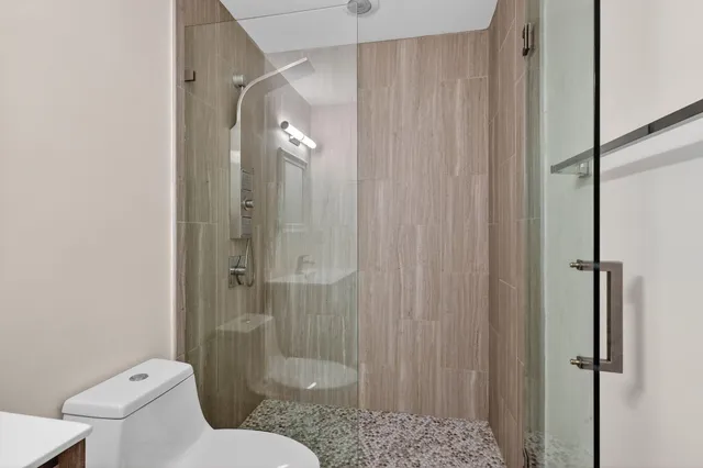 a view of a house with a yard and pathway