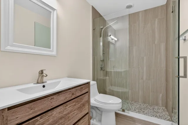 a view of a lake with houses in the back