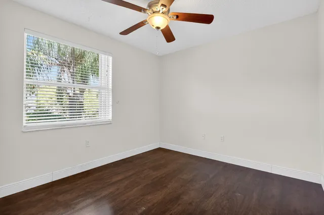a view of a lake with houses in the back