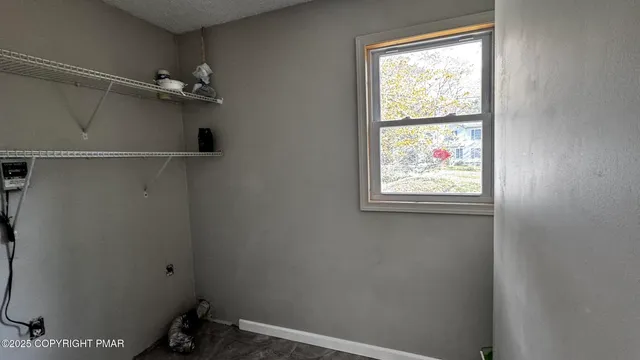 a view of front door with wooden floor