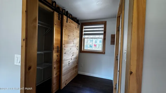 a view of a patio with table and chairs with wooden floor and fence
