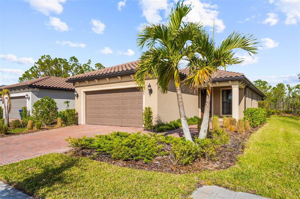 1384 Raspberry Dr Port North Port, FL 34289 - Photo 1 of 1 a front view of house with yard and green space