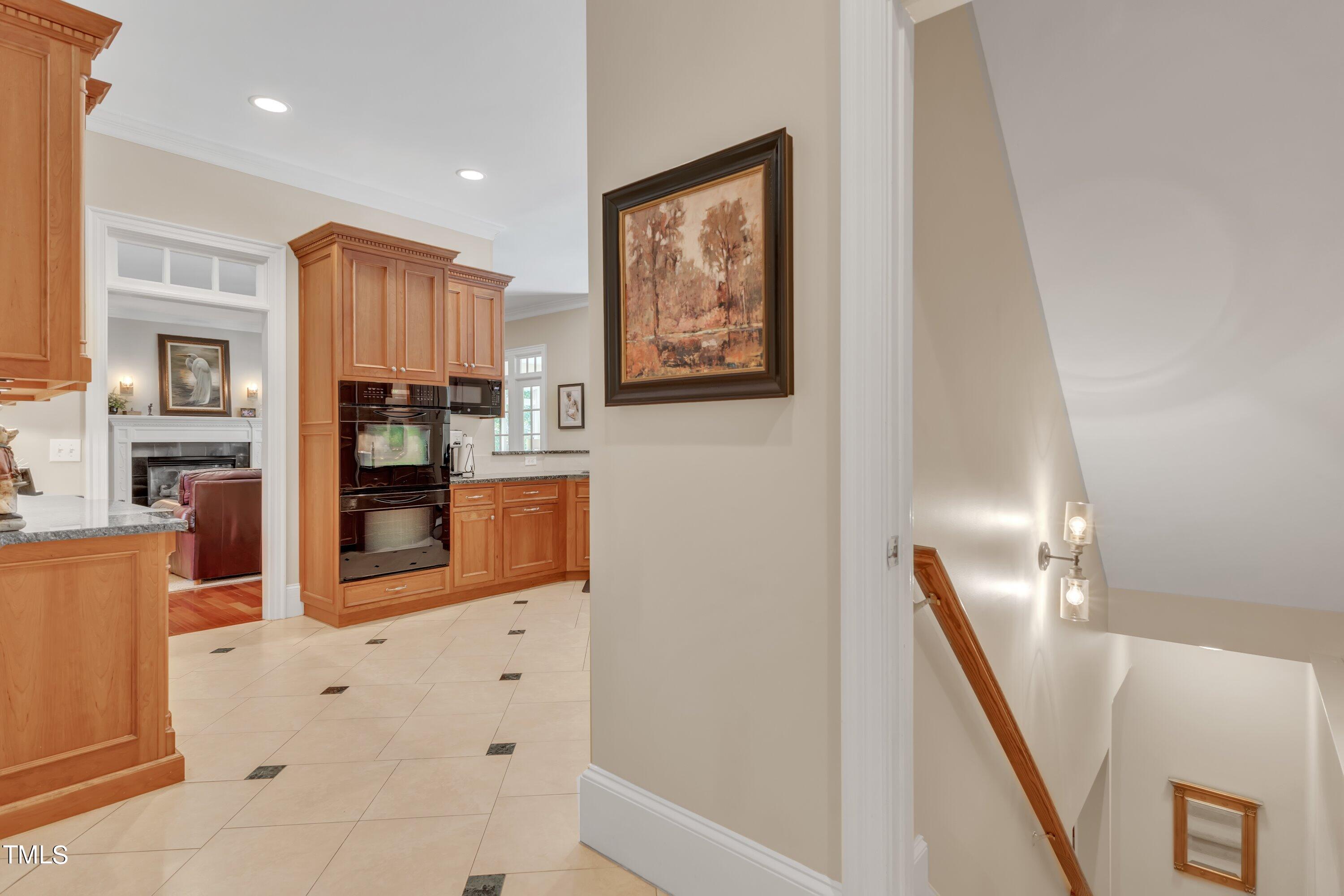 11220 Brass Kettle Road Raleigh, NC 27614 - Photo 32 of 86 Hall off kitchen from Laundry with view of staircase to basement