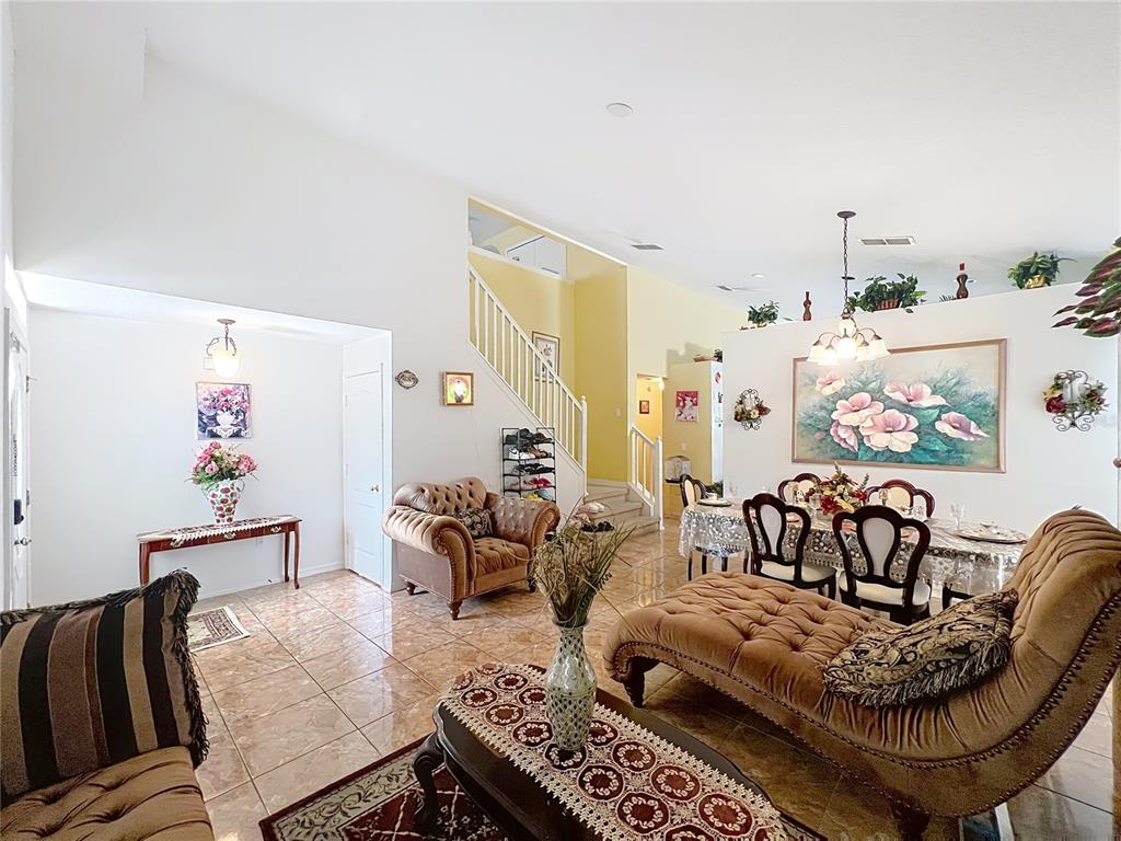 7939 Riffle Lane Orlando, FL 32818 - Photo 5 of 52 a living room with furniture and a couch