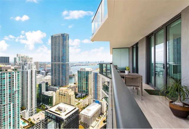 a view of city from balcony with furniture