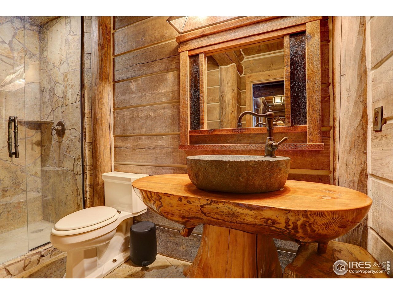 9126 Gold Mine Road Fort Collins, CO 80526 - Photo 27 of 40 a bathroom with a sink a toilet and shower
