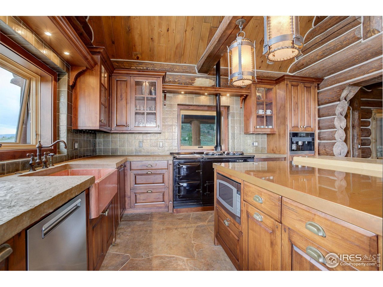 9126 Gold Mine Road Fort Collins, CO 80526 - Photo 10 of 40 a kitchen with cabinets a sink and appliances