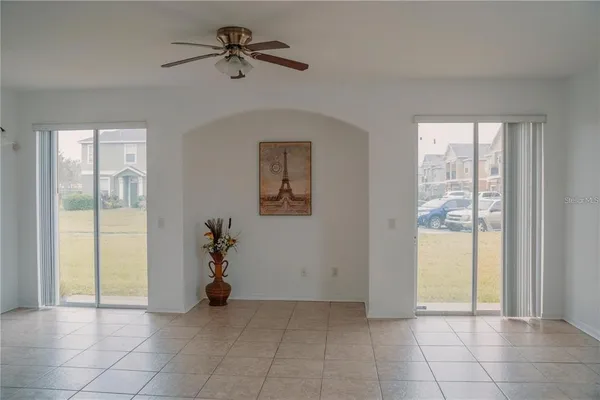 a view of an entryway with a chandelier fan