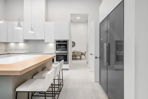 a utility room with sink dryer and washer