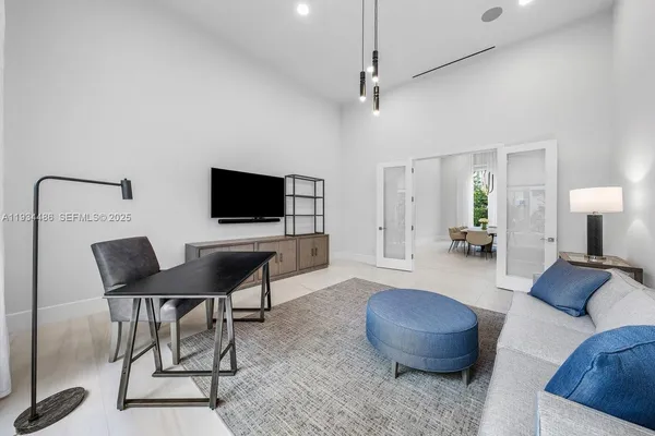 a living room with furniture and a large window