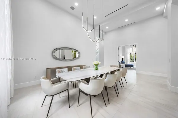 a dining room with furniture and a window