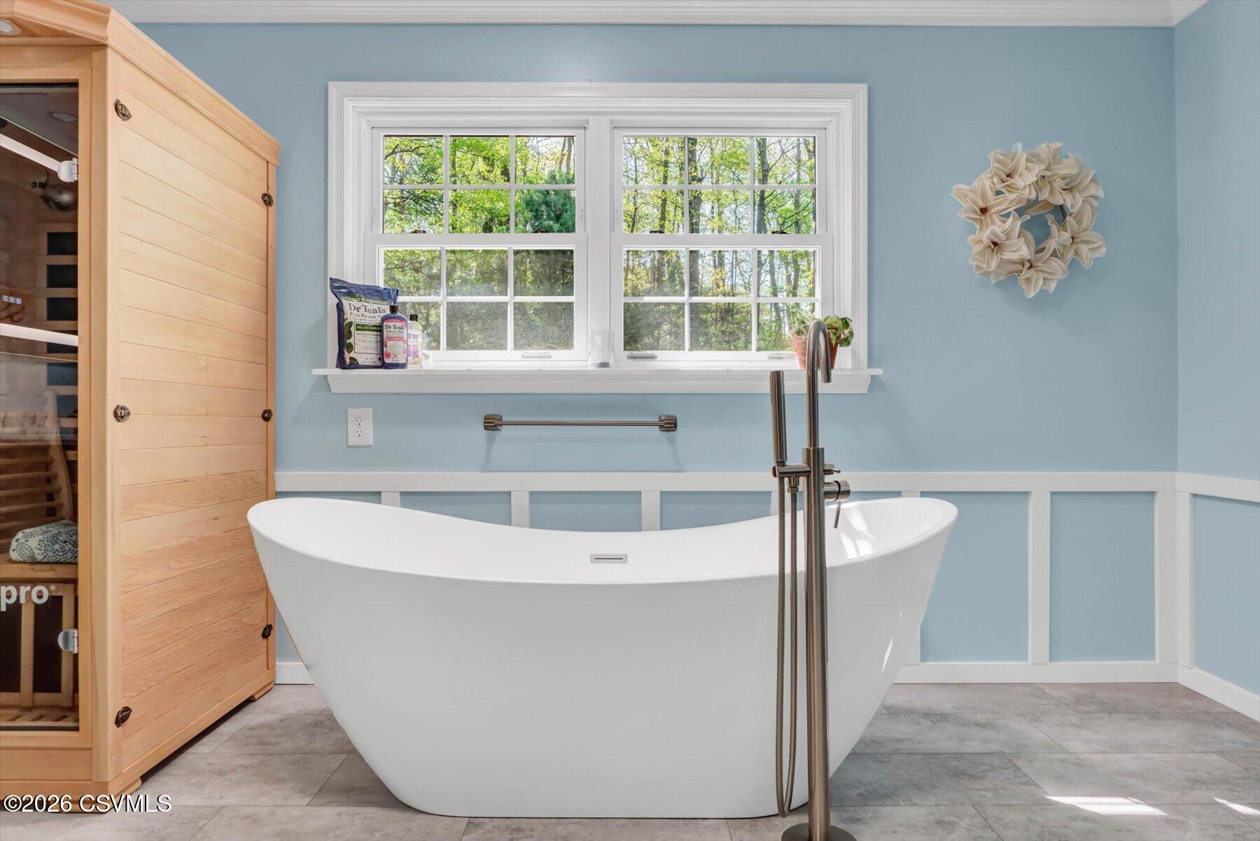 65 Crestview Drive Winfield, PA 17889 - Photo 31 of 70 a white bath tub sitting in a bathroom next to a window