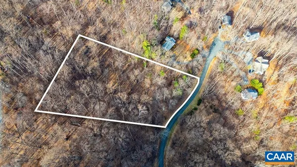 a view of an aerial view of residential houses with outdoor space and mountain view