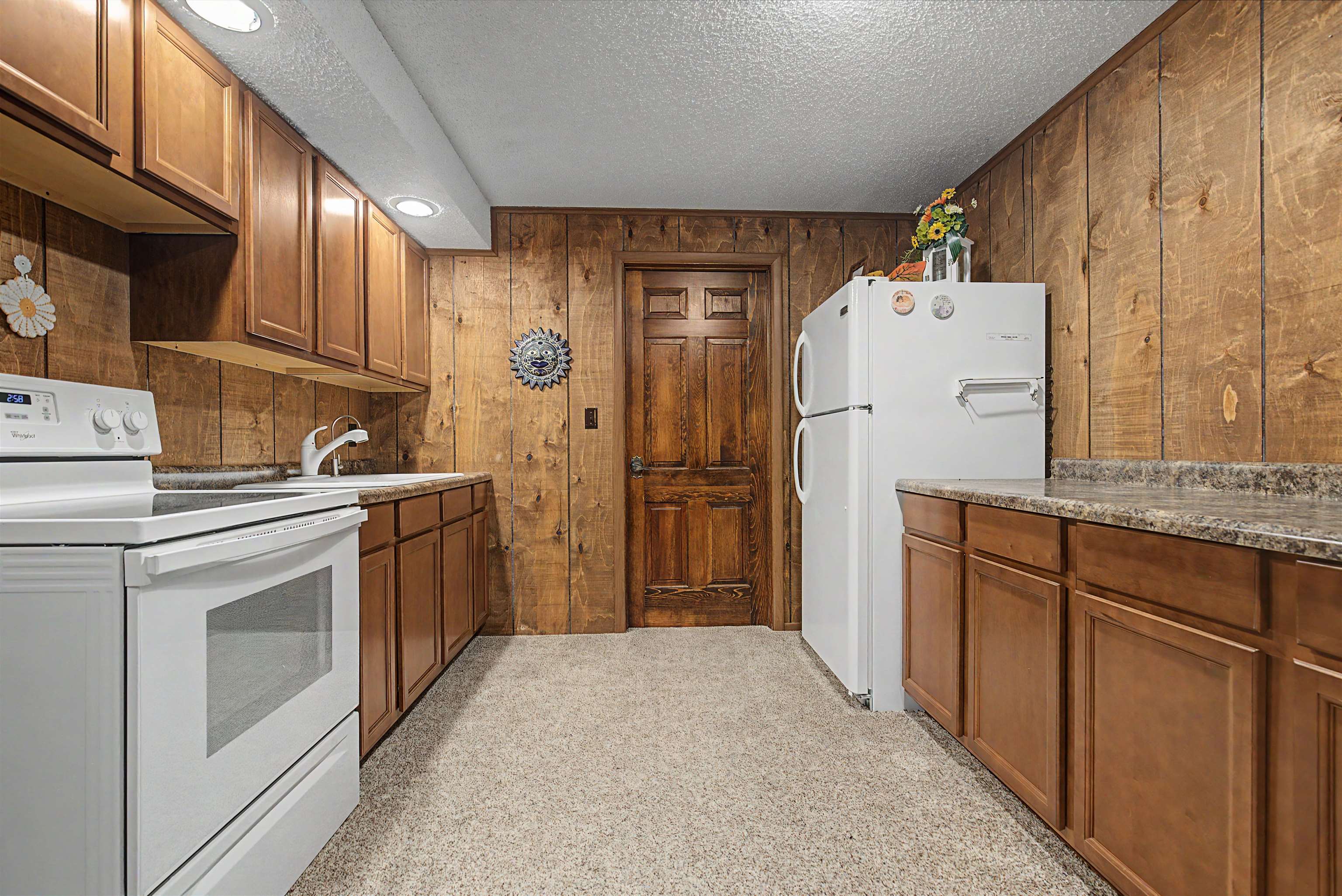 17380 Corbett Road Mount Carroll, IL 61053 - Photo 26 of 65 a kitchen with refrigerator and cabinets