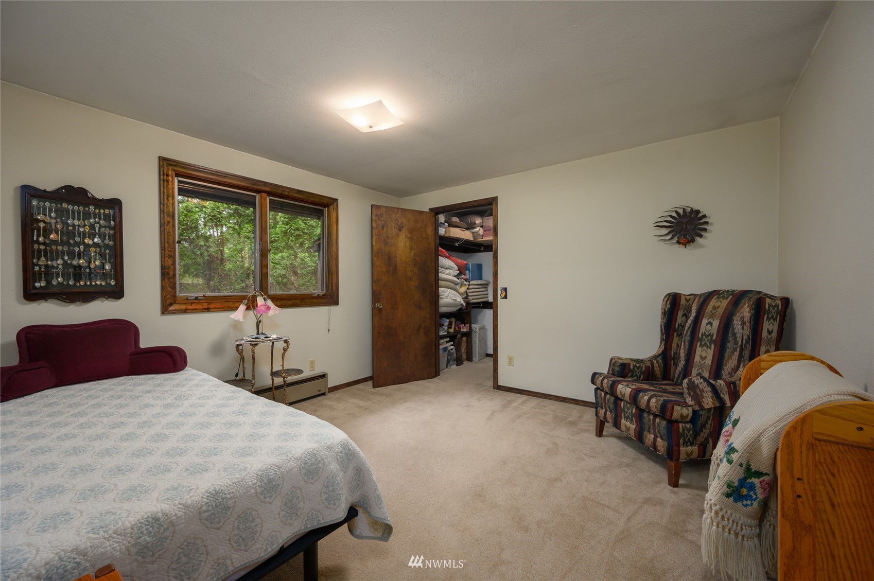 118 Sudden Valley Drive Bellingham, WA 98229 - Photo 20 of 35 a bedroom with a bed a dresser and a large window