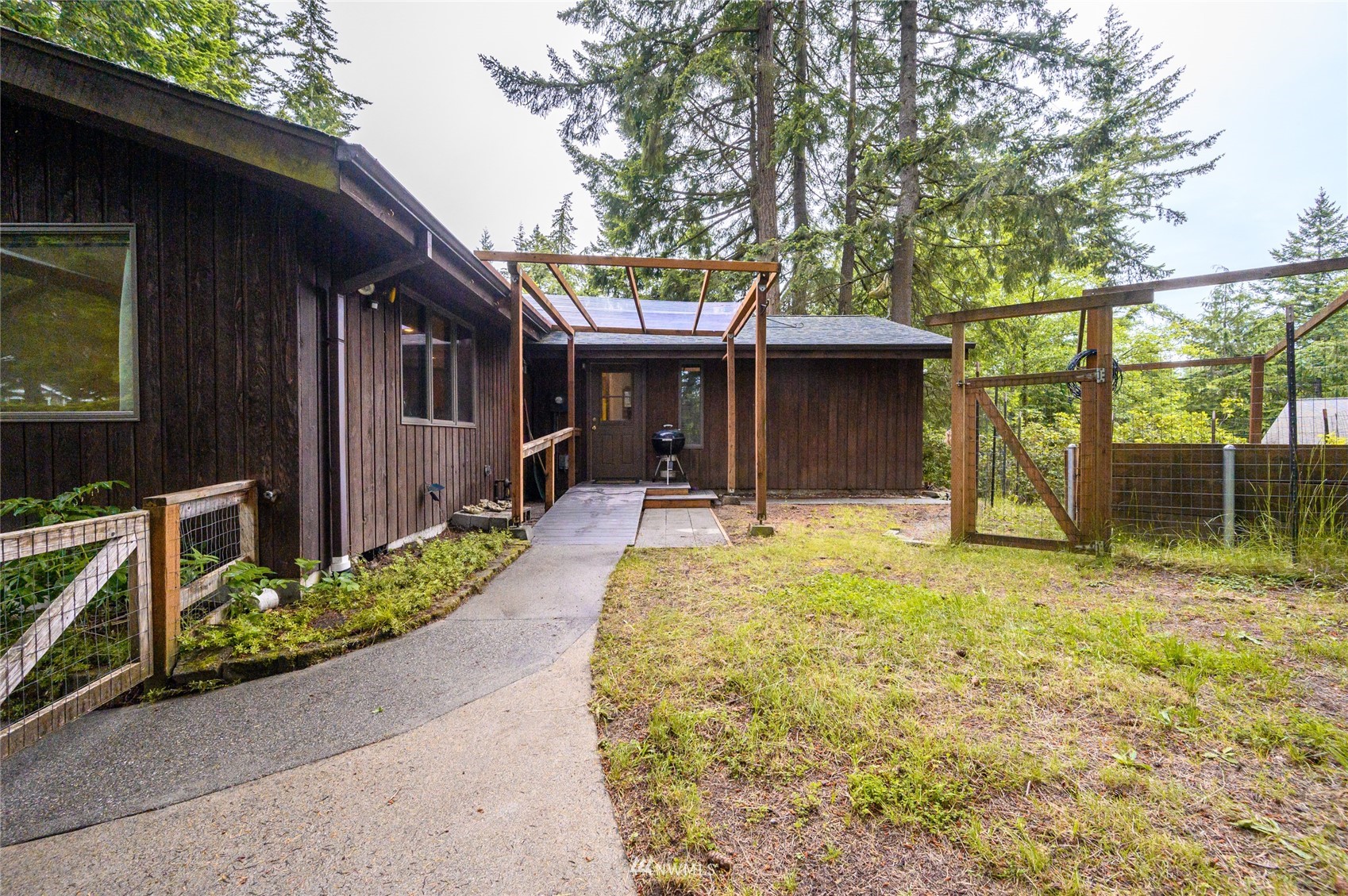 118 Sudden Valley Drive Bellingham, WA 98229 - Photo 22 of 35 a backyard of a house with yard and outdoor seating