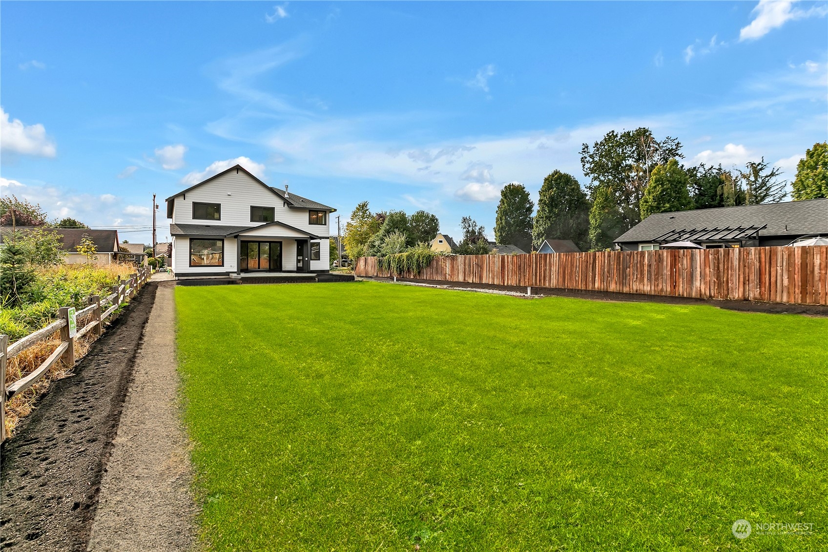 5425 Parker Road East Sumner, WA 98390 - Photo 39 of 40 a view of a house with a big yard and large trees
