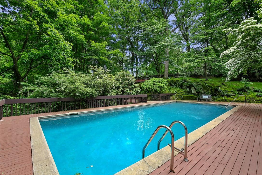 45 Polly Park Road Rye, NY 10580 - Photo 1 of 1 a view of a swimming pool with a patio