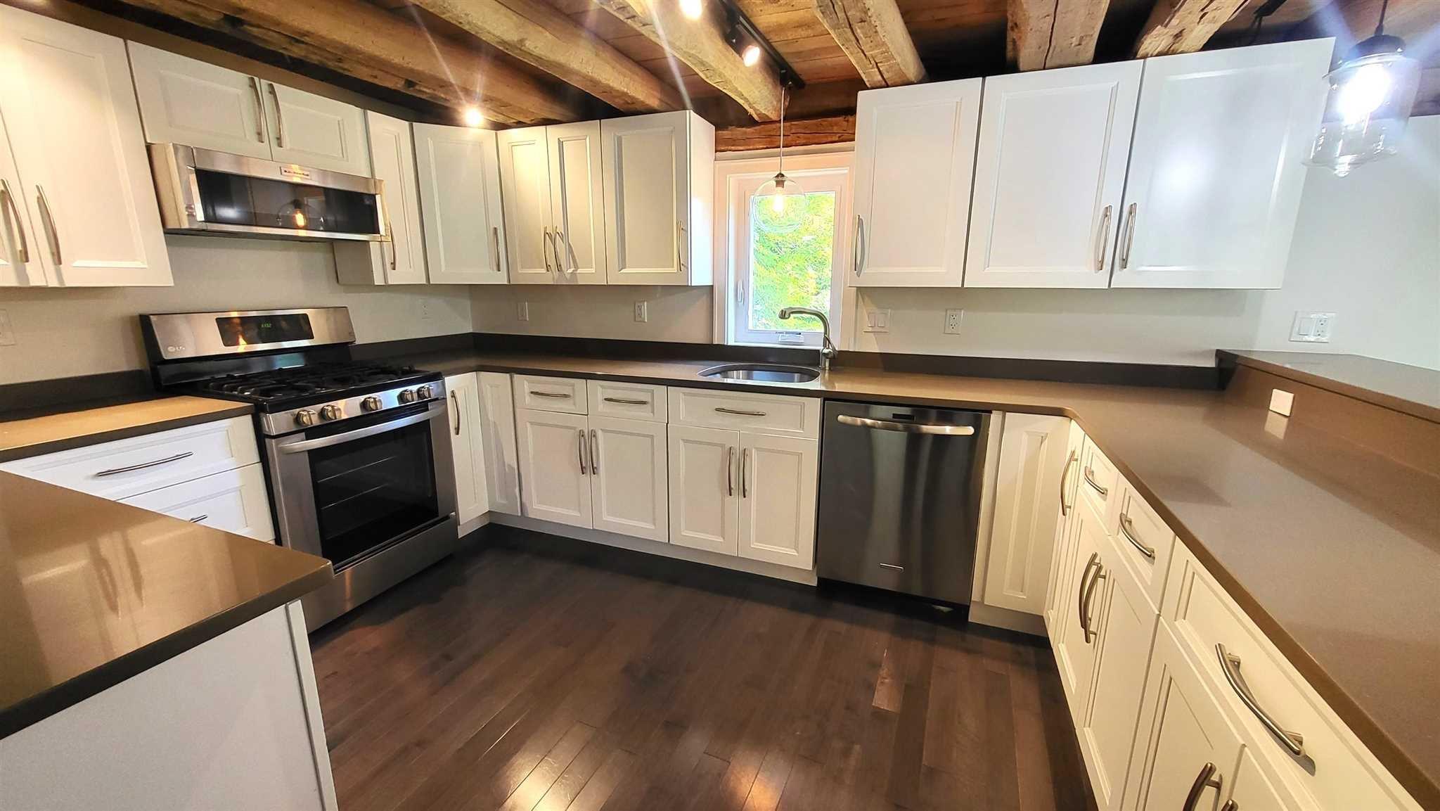7 Looking Rocks Lane Hopewell Junction, NY 12533 - Photo 6 of 22 a kitchen with stainless steel appliances granite countertop a stove a sink and a microwave