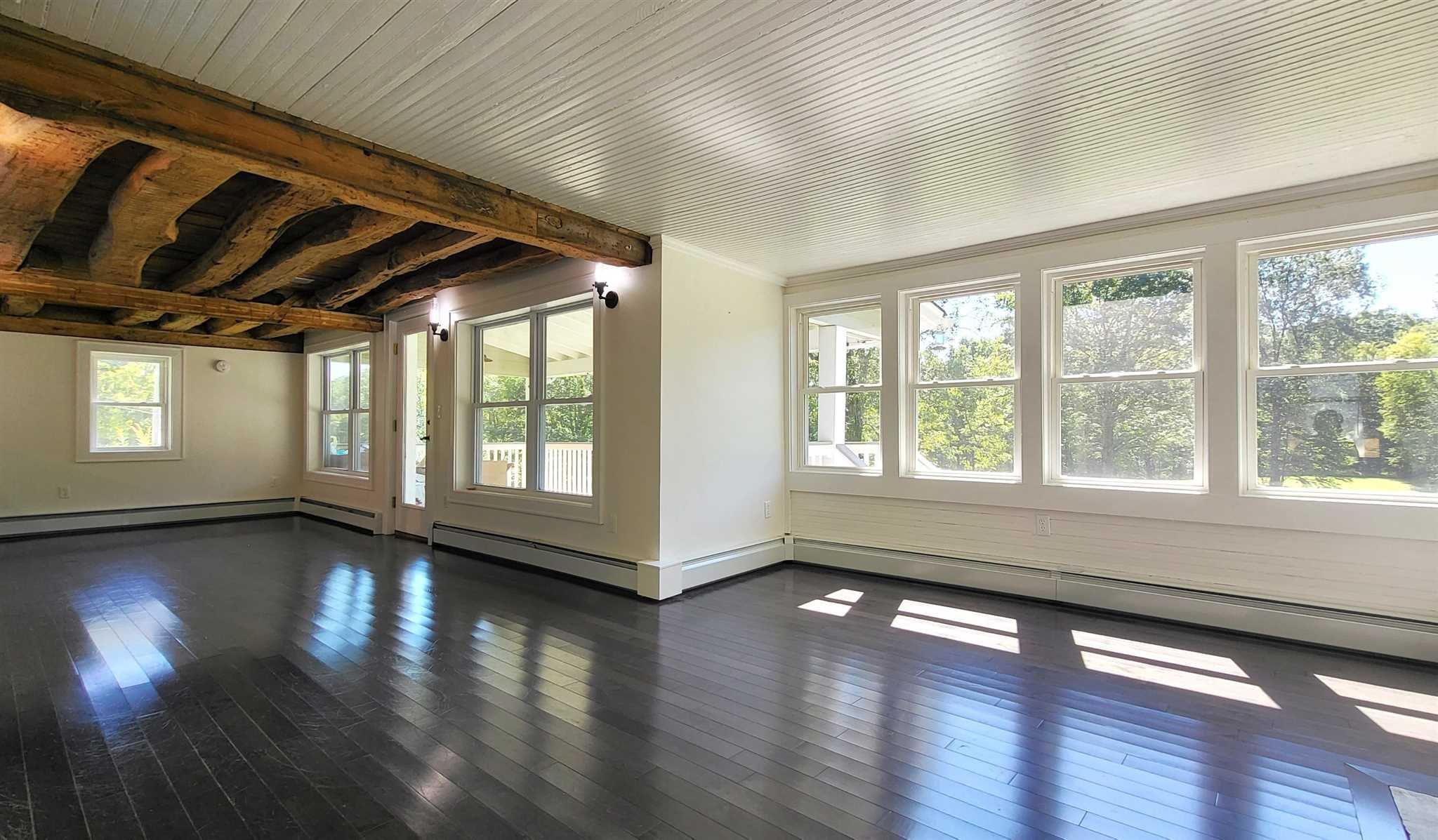 7 Looking Rocks Lane Hopewell Junction, NY 12533 - Photo 10 of 22 a view of an empty room with wooden floor and a window