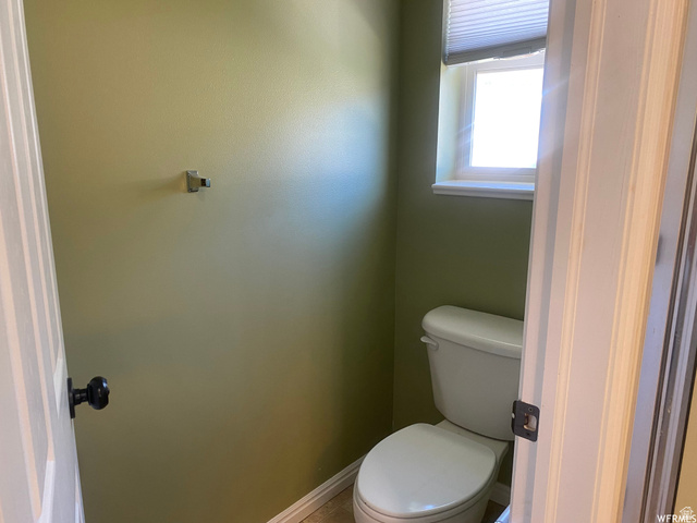 83 Canterbury Circle Logan, UT 84321 - Photo 14 of 23 Bathroom with toilet and baseboards