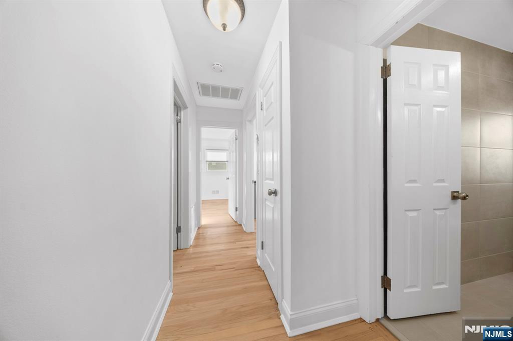 62 Sycamore Road Dumont, NJ 07628 - Photo 27 of 43 a view of a hallway with wooden floor