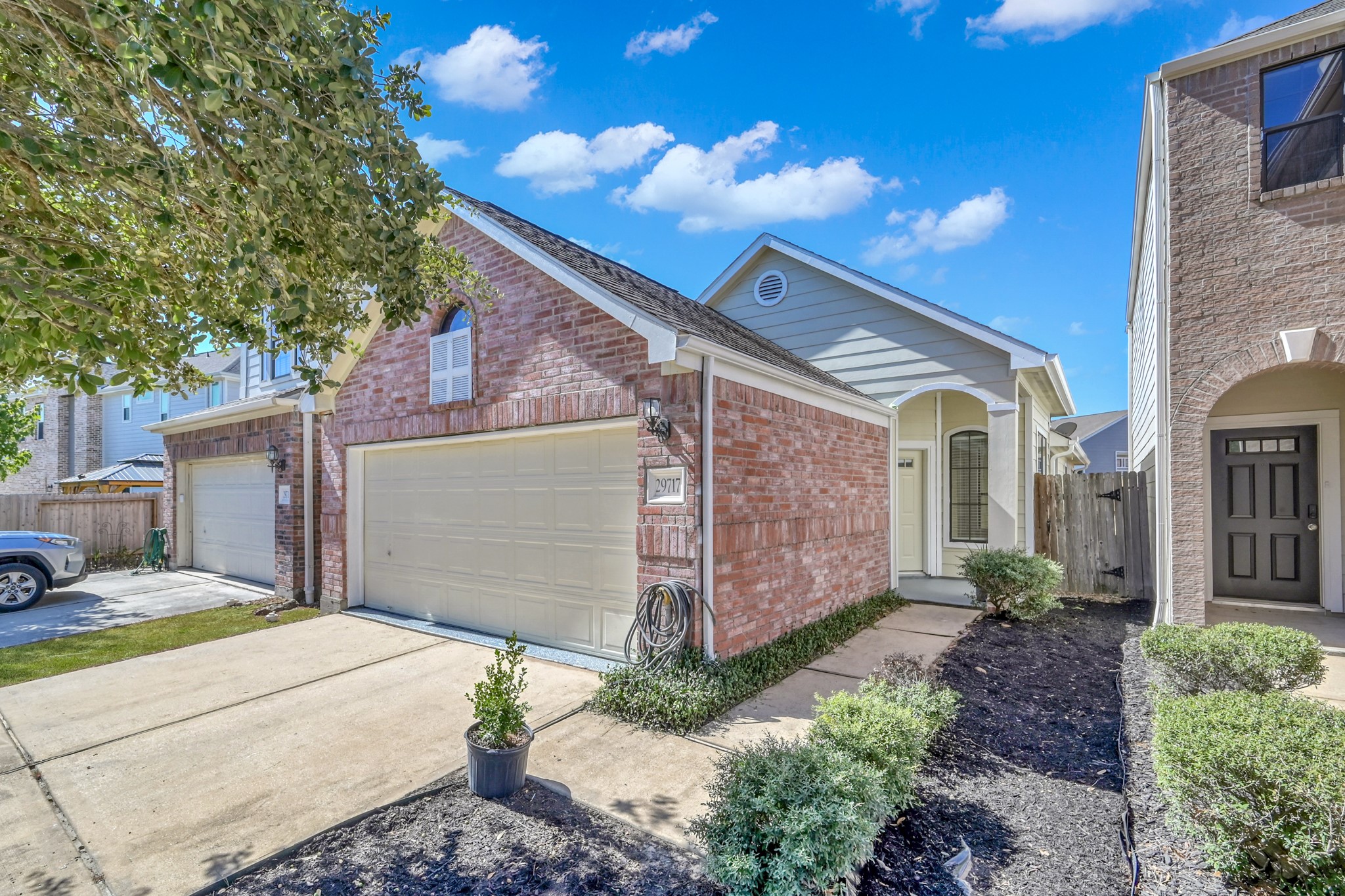 a front view of a house with garden