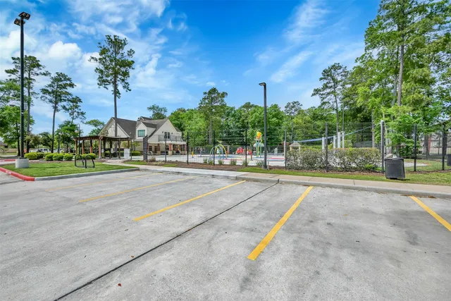 a view of a playground with basketball court