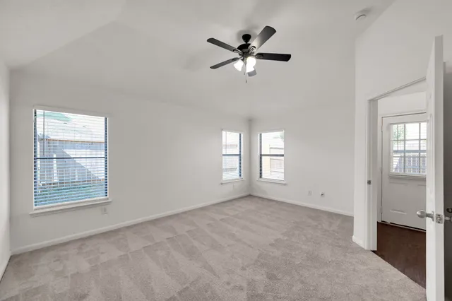 a view of an empty room with a window