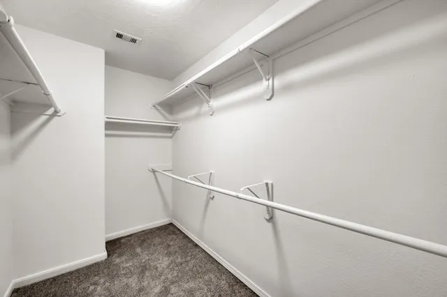 a view of an empty walk in closet