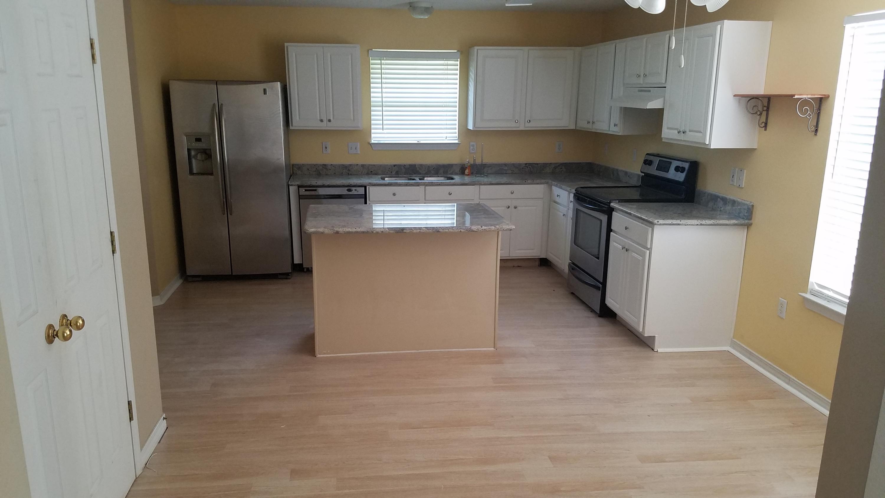 176 Beacon Way Miramar Beach, FL 32550 - Photo 5 of 11 a kitchen with stainless steel appliances granite countertop a stove a refrigerator and a sink