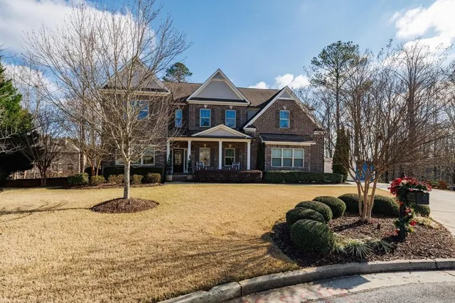 a front view of a house with a yard