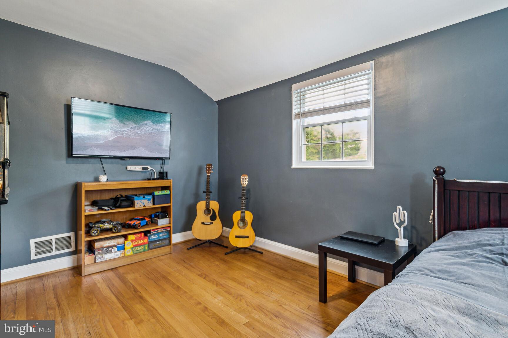 8504 Grubb Road Chevy Chase, MD 20815 - Photo 15 of 29 a bedroom with furniture and a window