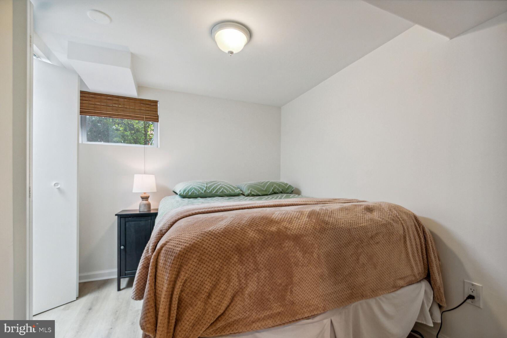 8504 Grubb Road Chevy Chase, MD 20815 - Photo 16 of 29 a bedroom with a bed and a window