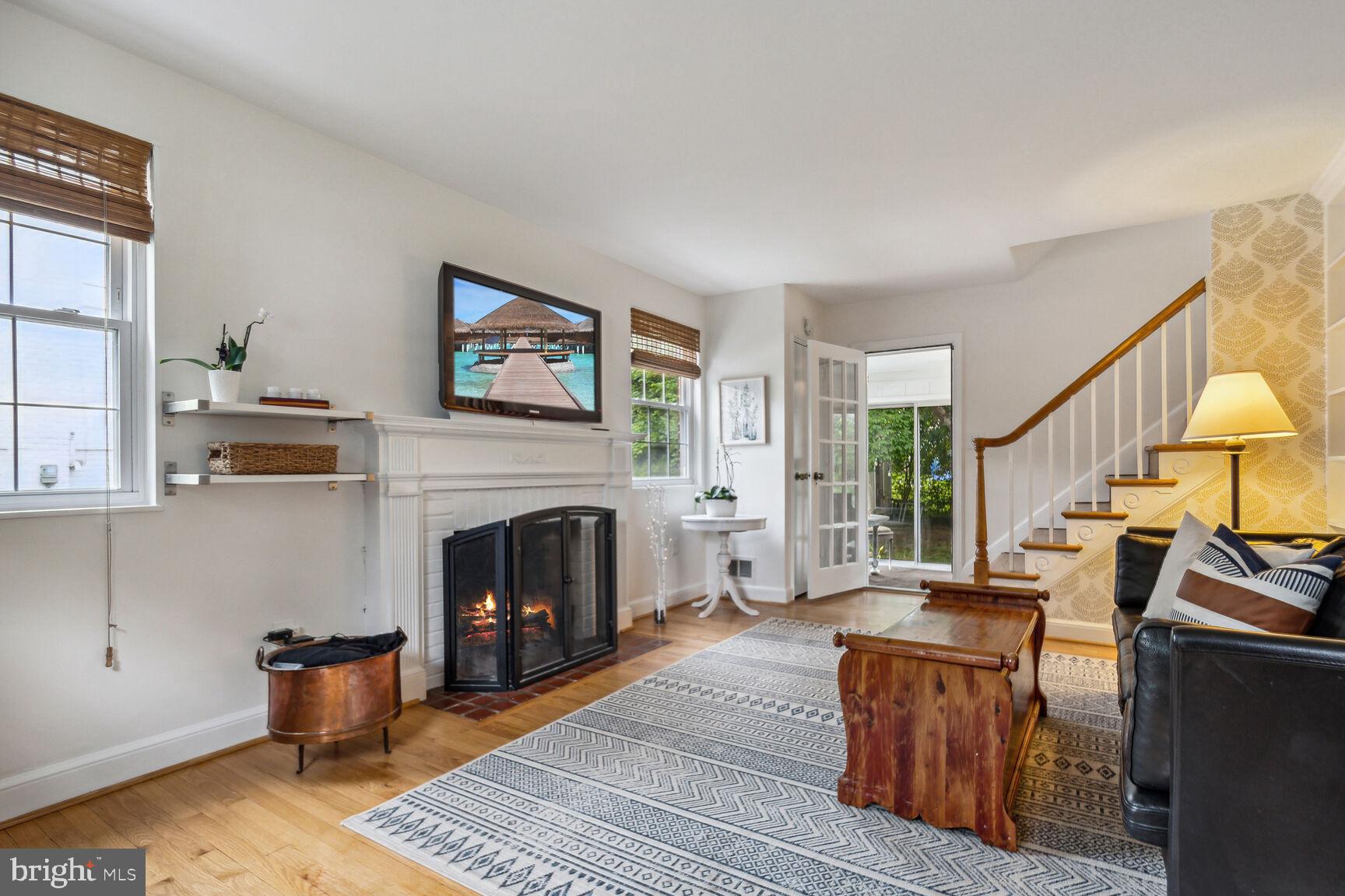 8504 Grubb Road Chevy Chase, MD 20815 - Photo 4 of 29 a living room with furniture and a fireplace
