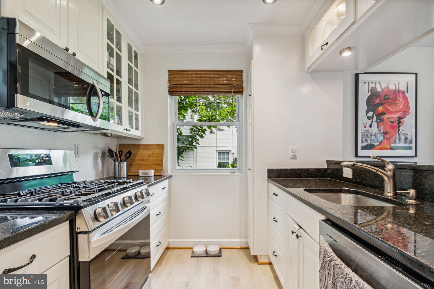 8504 Grubb Road Chevy Chase, MD 20815 - Photo 7 of 29 a kitchen that has a sink and a stove