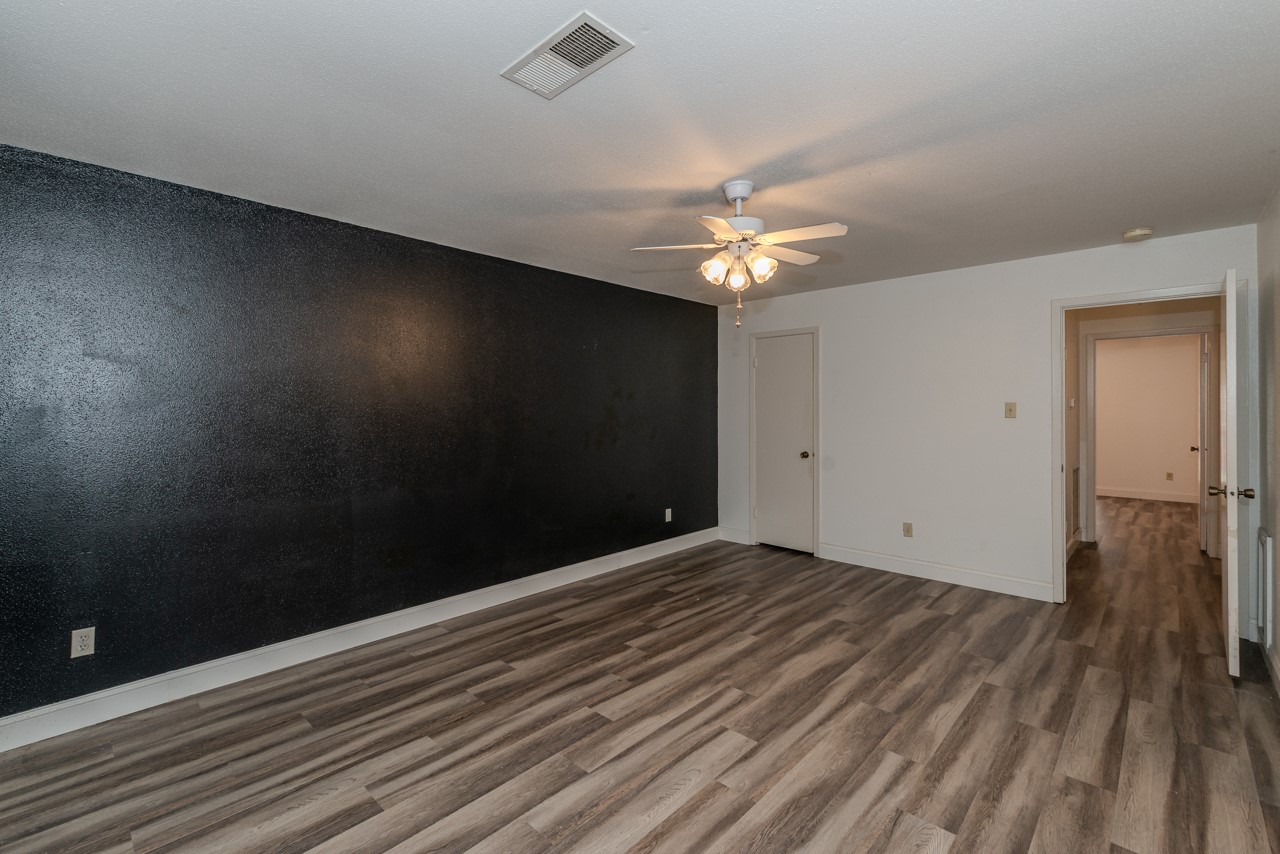 5975 Meadow Way Beaumont, TX 77707 - Photo 13 of 18 wooden floor in an empty room