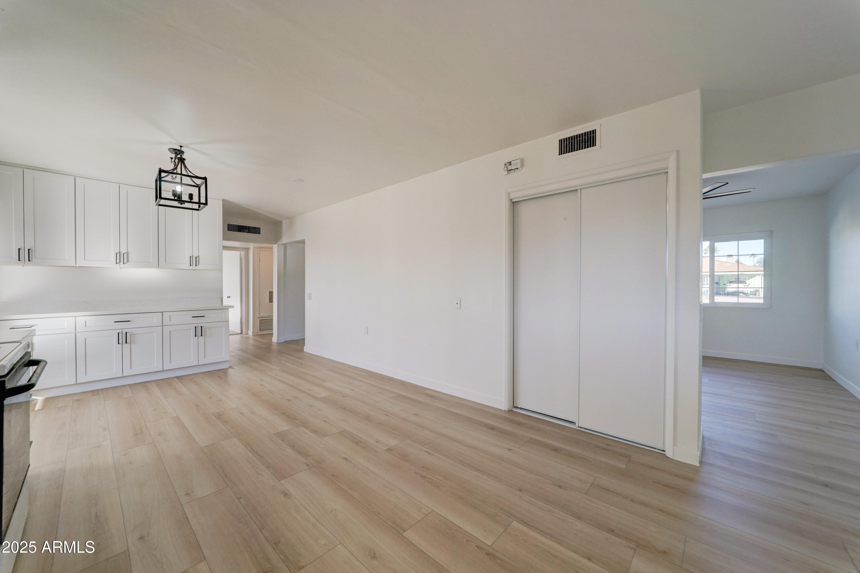 2039 West Northview Avenue Phoenix, AZ 85021 - Photo 13 of 30 a view of a kitchen with wooden floor and electronic appliances