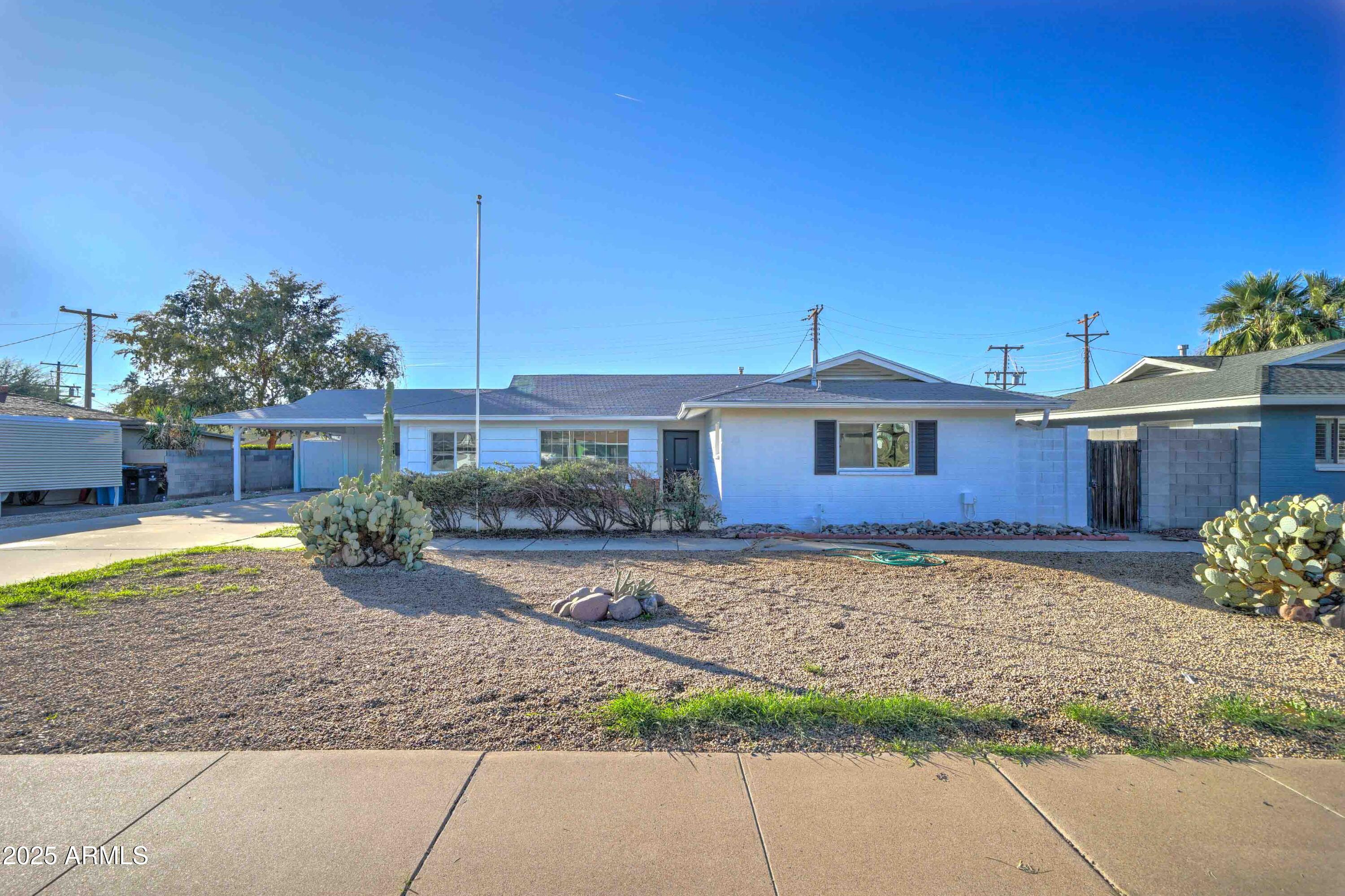 2039 West Northview Avenue Phoenix, AZ 85021 - Photo 2 of 30 a view of a house with a yard and potted plants