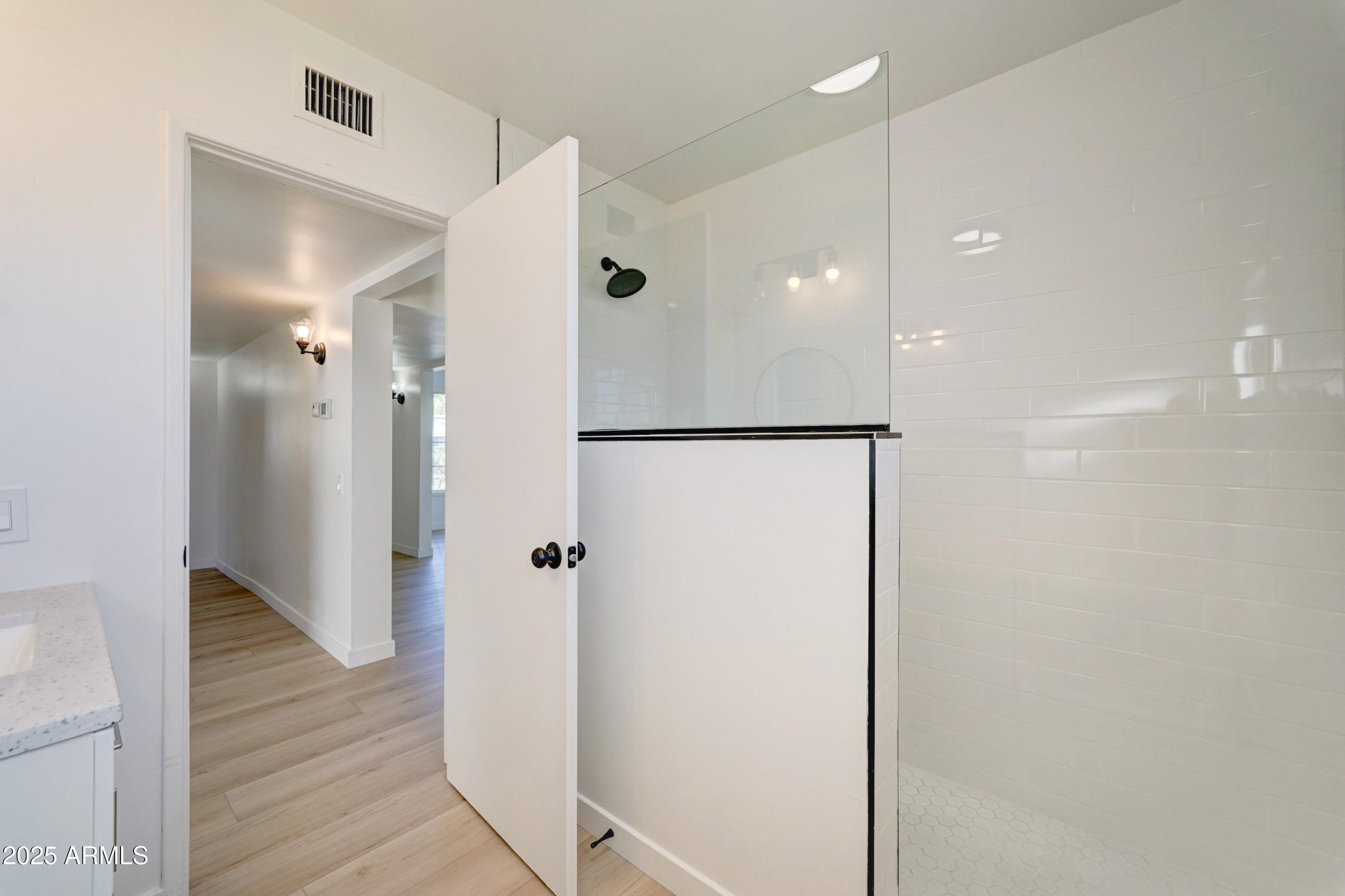 2039 West Northview Avenue Phoenix, AZ 85021 - Photo 25 of 30 a bathroom with a shower and a glass door