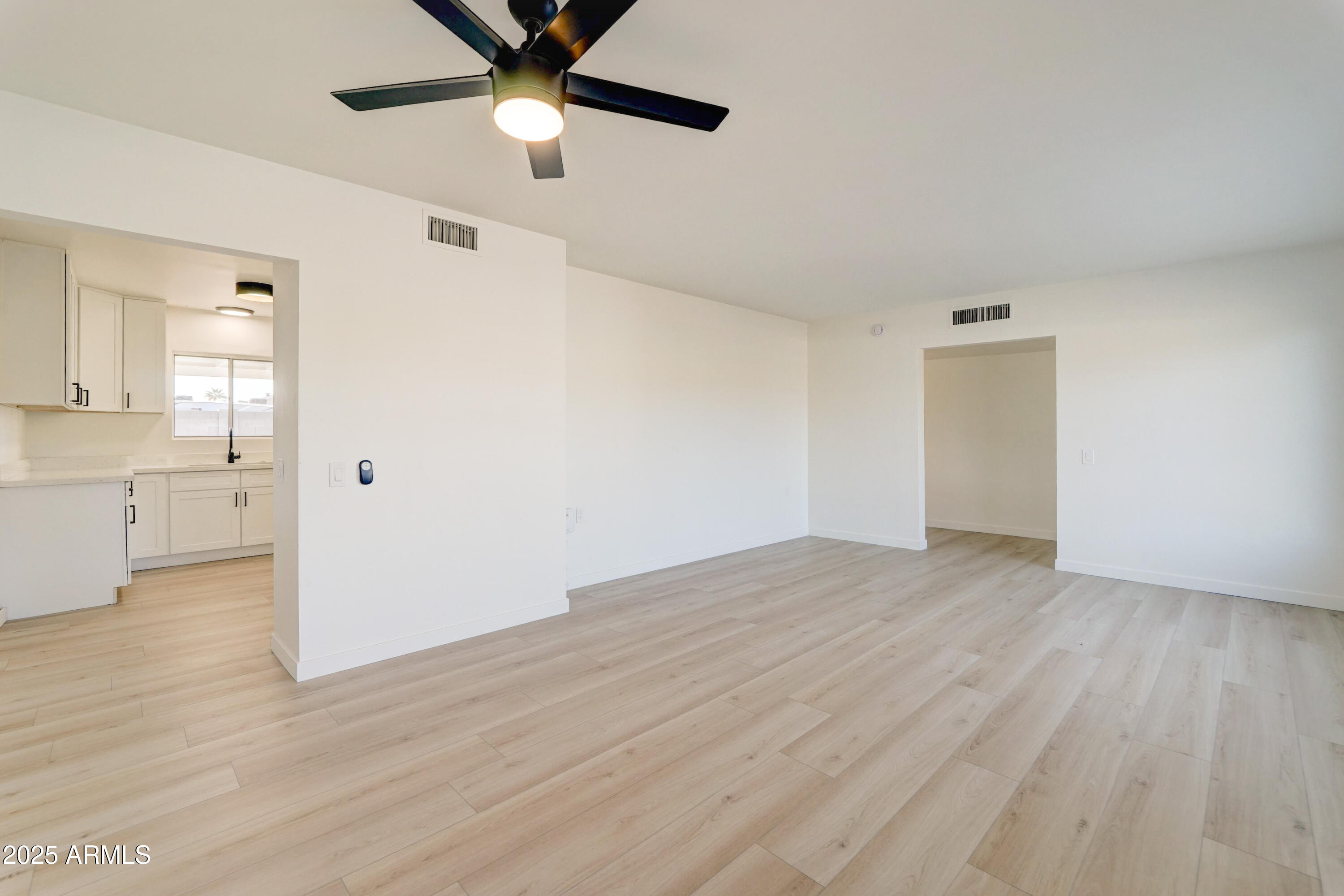 2039 West Northview Avenue Phoenix, AZ 85021 - Photo 5 of 30 wooden floor in an empty room with a window