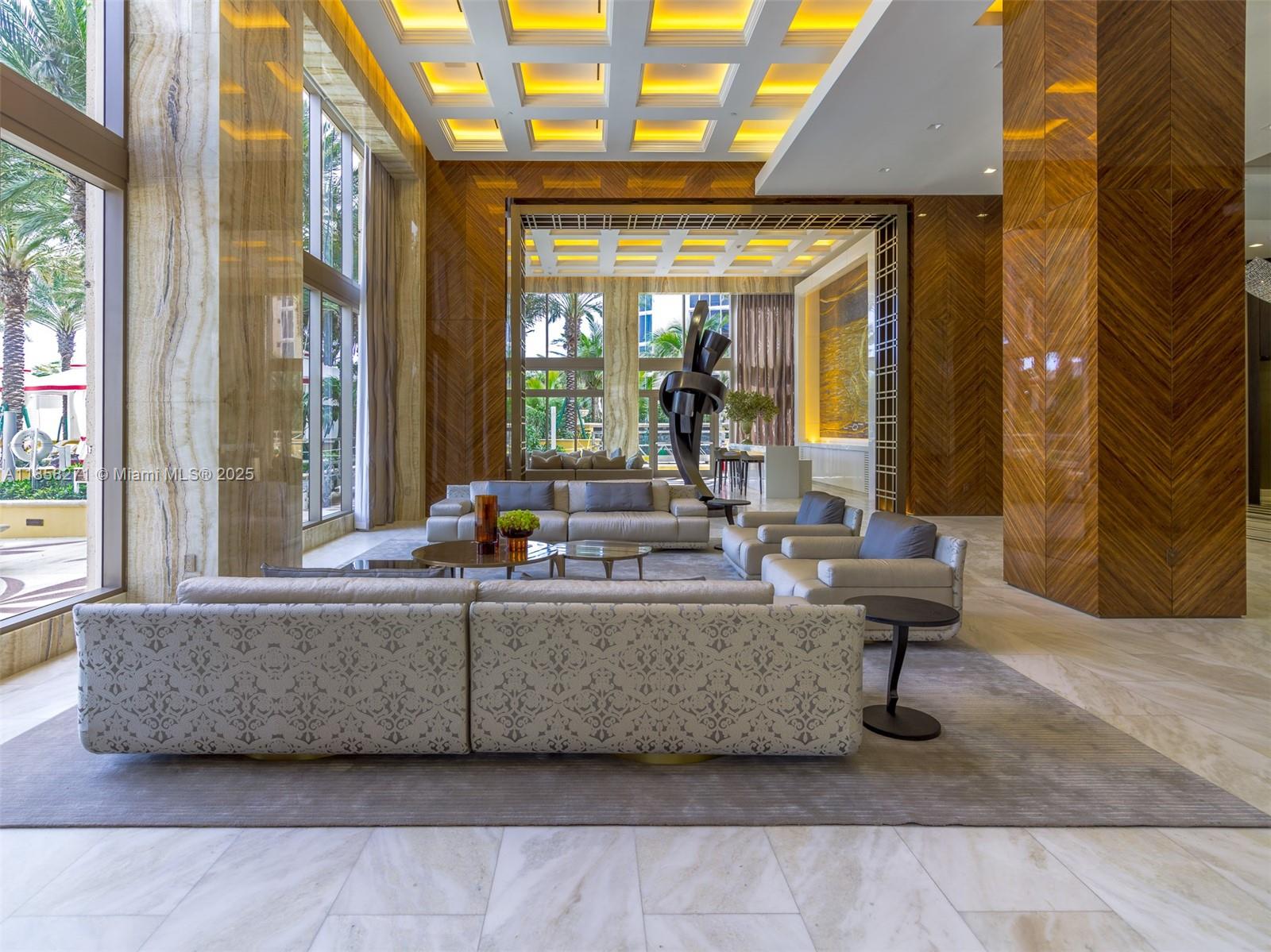 17749 Collins Avenue, Unit 802 Sunny Isles Beach, FL 33160 - Photo 5 of 25 a living room with furniture and a large window