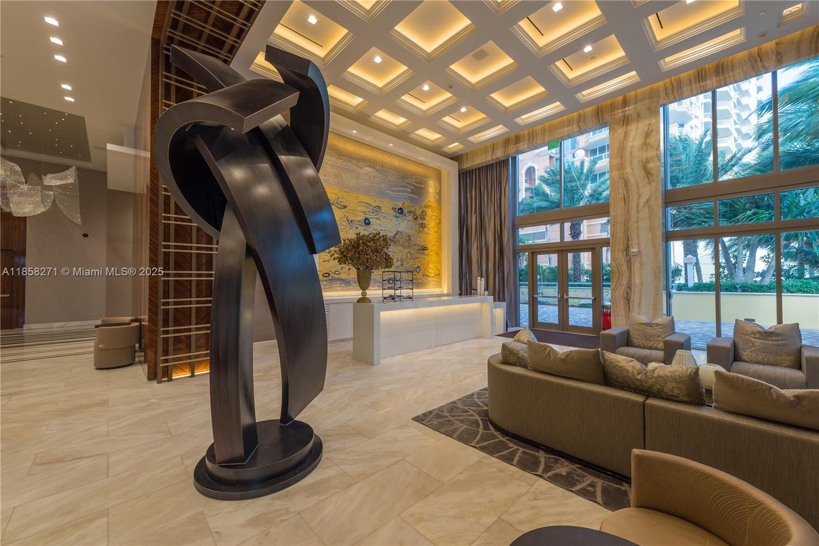 17749 Collins Avenue, Unit 802 Sunny Isles Beach, FL 33160 - Photo 6 of 25 a living room with furniture and a potted plant