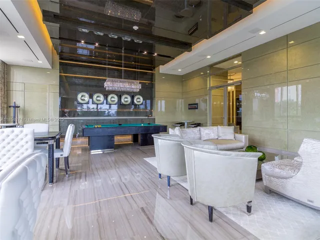 a large room with lots of wooden furniture and glass door