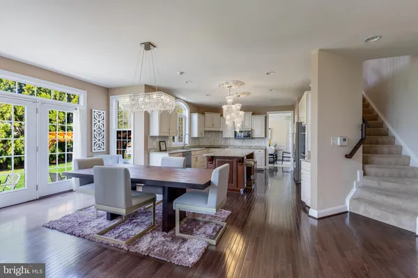 a living room with furniture a fireplace and a table