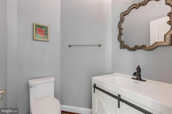 a large bathroom with a double vanity sink a large mirror and a bathtub