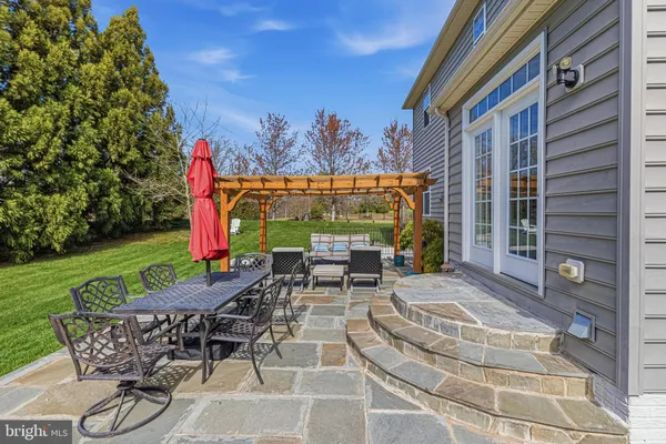 a view of an chairs and tables in the patio